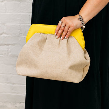 ALLBYB Becca Canvas Yellow Clutch being held